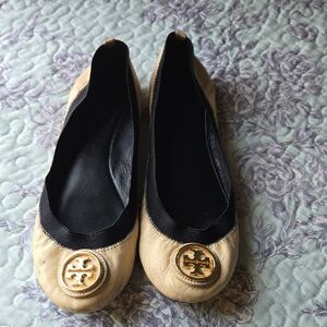Tory Burch Black and Tan Flats with Gold Emblem